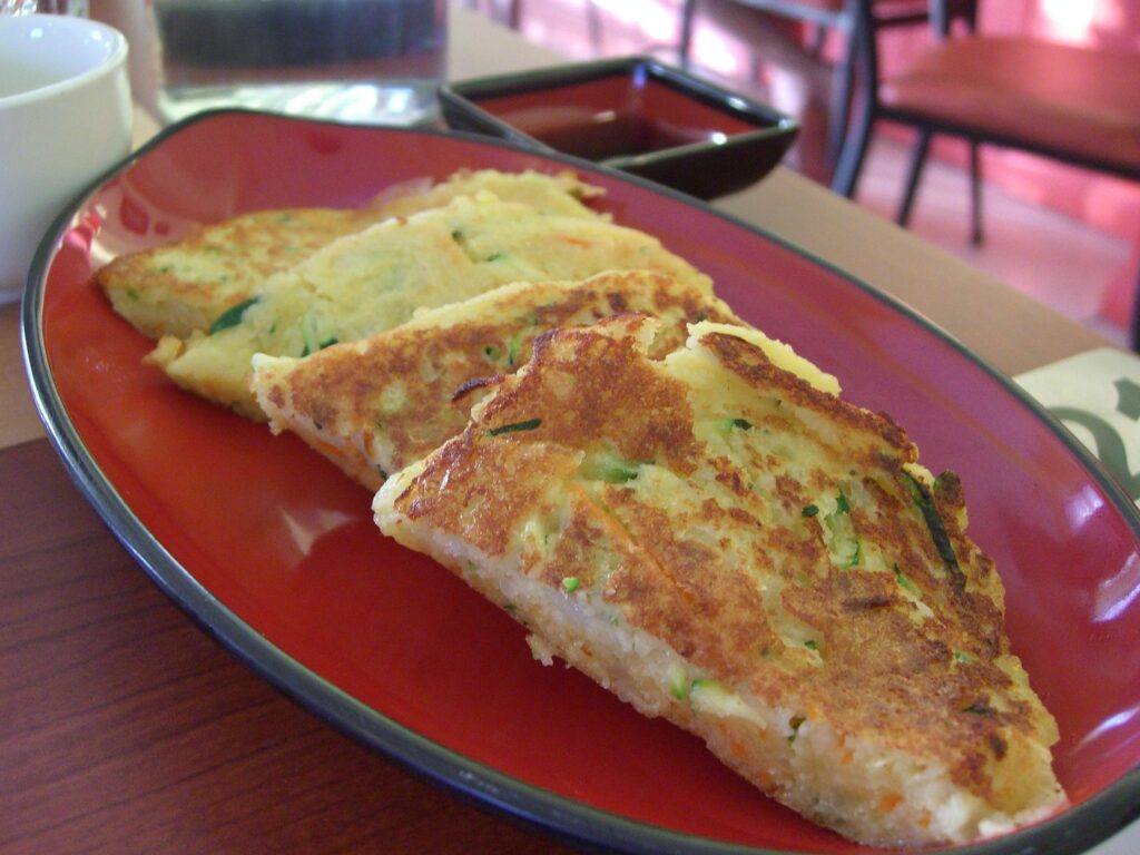 Served on a plate: a thick mung-bean pancake with its deep-golden, shatteringly crisp surface.
