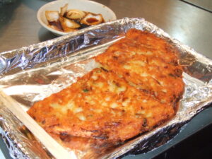 Bindaetteok (빈대떡), the crispy Korean mung-bean pancake, fresh from a street market in Seoul.