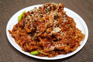 Dakbal-bokkeum, Korean stir-fried spicy chicken feet glazed in gochujang sauce (Photo: 김정옥 (Kim Jeong-ok), CC BY 2.0 via Wikimedia Commons)