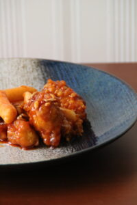 Dakgangjeong, Korean sweet and crispy double-fried chicken, served on a plate.