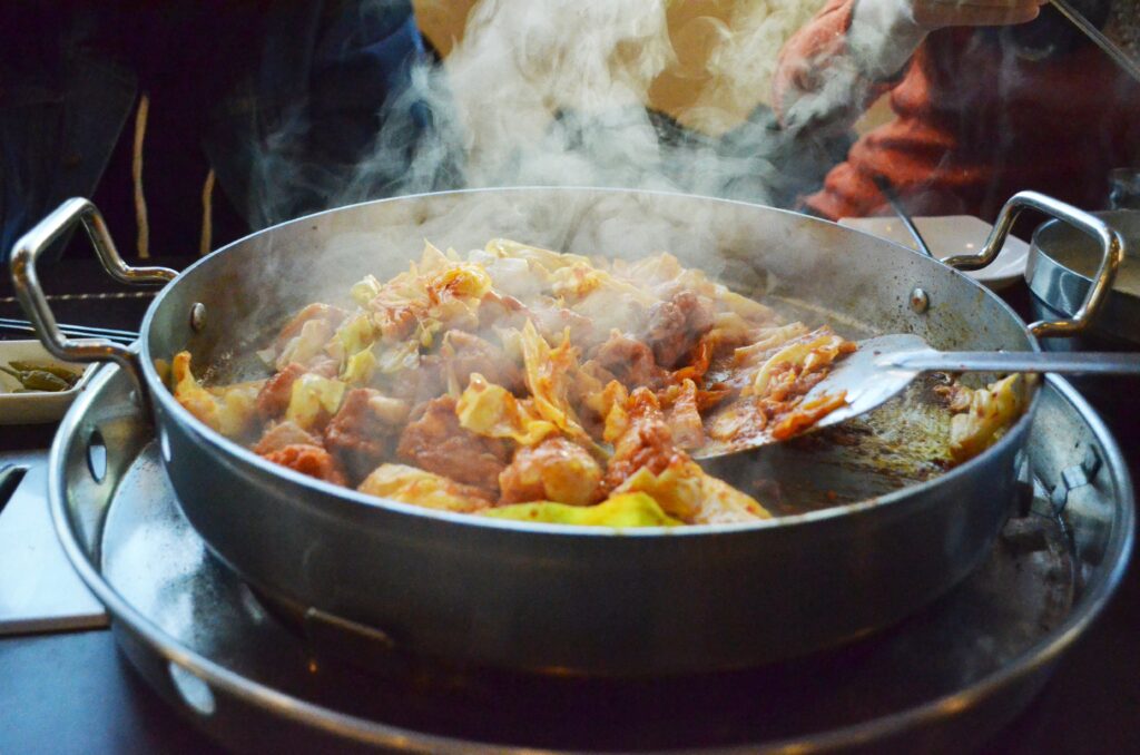 닭갈비 (Dak-galbi / Korean spicy stir-fried chicken) — a representative photo of the dish, not necessarily from the restaurants above. Photo: Photo by Hye-youngJung via Wikimedia Commons, CC0 1.0