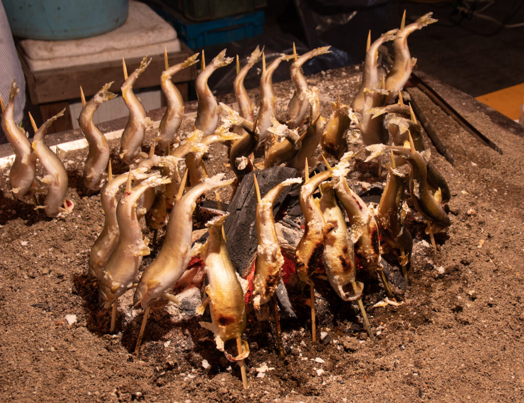 Euneo-gui — whole sweetfish salt-grilled on a skewer, the most prized cooked preparation. (Photo: Σ64 / Sigma64, CC BY 4.0, via Wikimedia Commons)