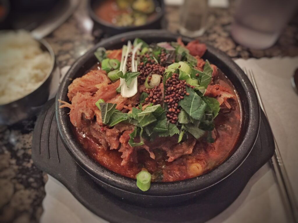 Gamjatang (pork neck stew) served at a Korean restaurant, ready to share. (Photo: T.Tseng, CC BY 2.0 via Wikimedia Commons)