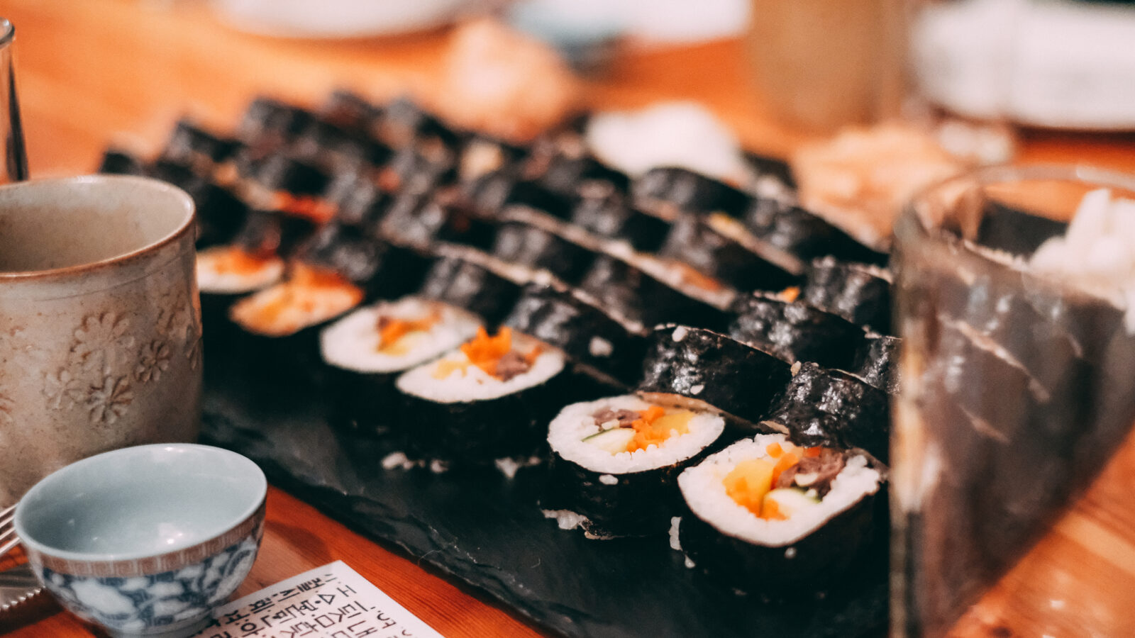 Freshly made gimbap sliced into bite-size rounds, showing the colorful row of fillings. Photo: Karlis Dambrans, via Wikimedia Commons.