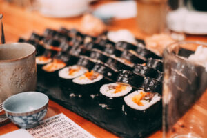 Freshly made gimbap sliced into bite-size rounds, showing the colorful row of fillings. Photo: Karlis Dambrans, via Wikimedia Commons.