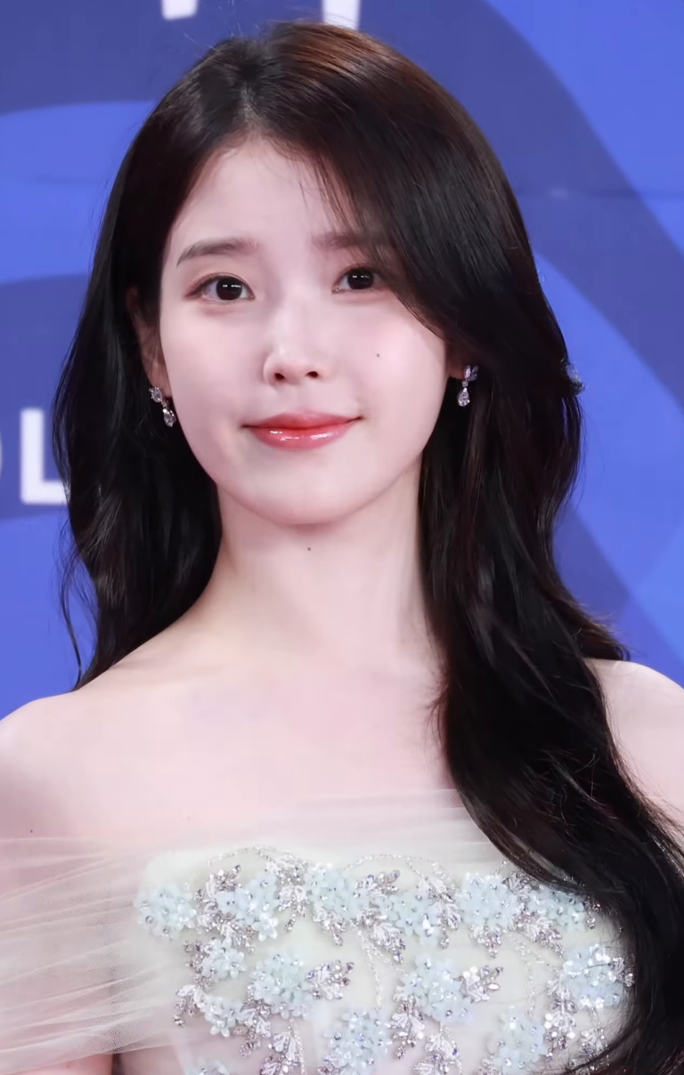 IU at the Blue Dragon Series Awards, July 2025, where she won Best Actress for When Life Gives You Tangerines. (Photo: 티비텐 TV10 (TV10 YouTube channel), CC BY 4.0, via Wikimedia Commons)