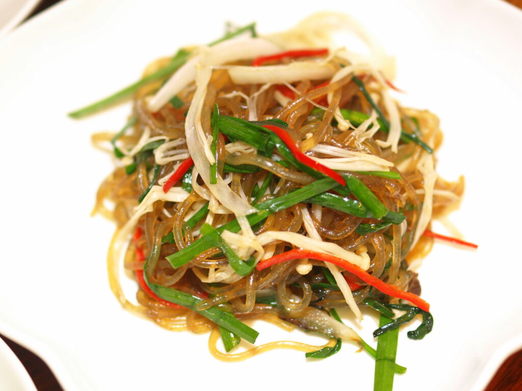 Japchae's signature jewel-bright mix of dangmyeon noodles, vegetables, and seasoned beef.