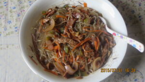 Homemade japchae (잡채), Korea's glossy stir-fried sweet-potato glass noodles tossed with vegetables and beef.