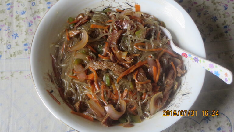 Homemade japchae (잡채), Korea's glossy stir-fried sweet-potato glass noodles tossed with vegetables and beef.