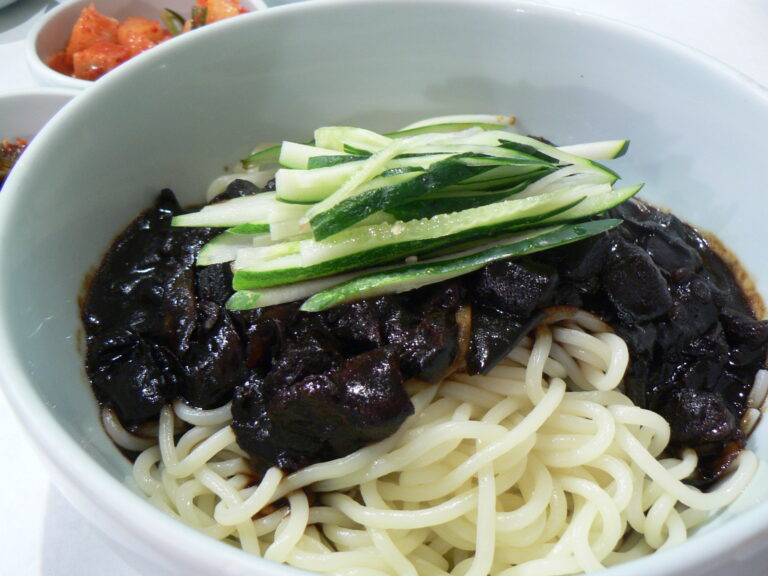 Jjajangmyeon: chewy wheat noodles under a glossy black-bean sauce, served in a single bowl. Photo: stu_spivack / Wikimedia Commons / CC BY-SA 2.0.
