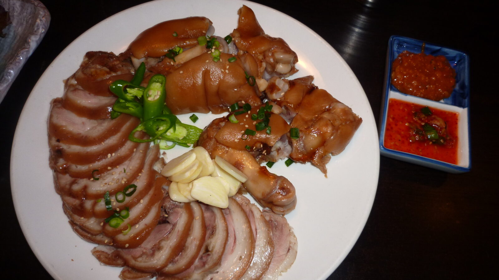 Jokbal — soy-braised pig's trotters sliced and plated for sharing. (Photo: Nesnad, CC BY-SA 3.0 via Wikimedia Commons)