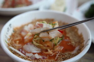 Mulhoe (물회), Korea's chilled raw-fish soup, in a sweet-spicy-tangy iced broth (Photo: 사람냄새, CC BY 2.0 KR via Wikimedia Commons)