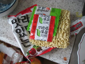 A steaming bowl of Korean ramyeon (라면).