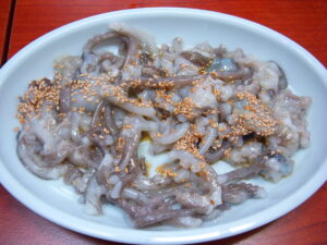 San-nakji (산낙지) hoe — freshly sliced small octopus served Korean-style with sesame seeds, the arms still moving.