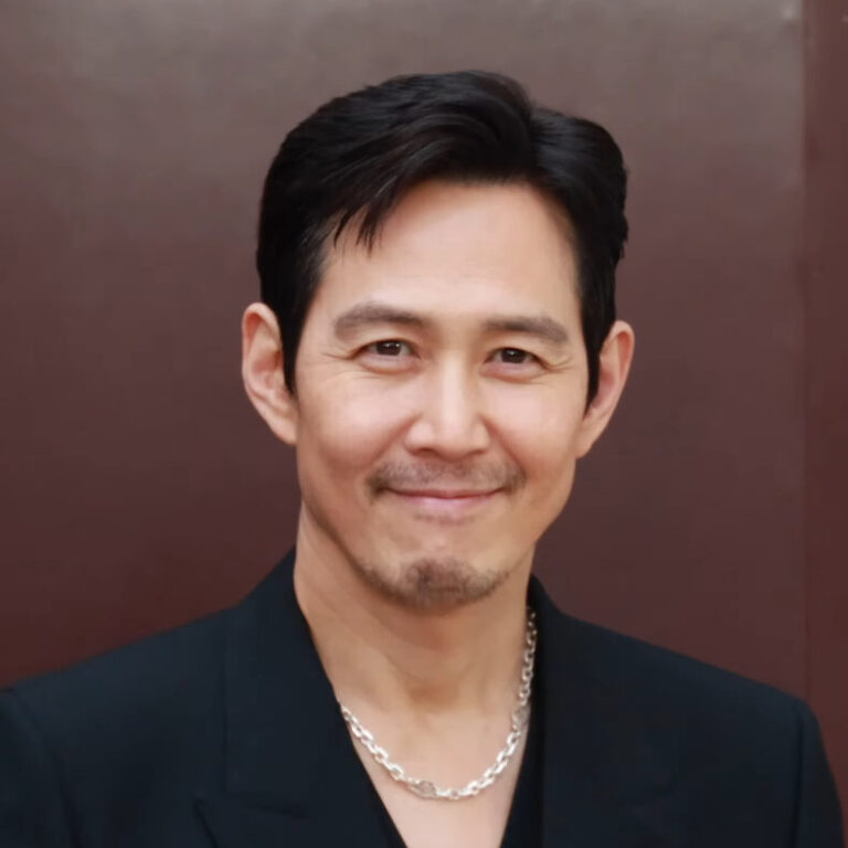 Lee Jung-jae (이정재), who returns as Seong Gi-hun / Player 456 in Squid Game Season 2, at a public appearance in March 2024. Public-event photo, not a still from the show. Photo by 티비텐 TV10 via Wikimedia Commons, CC BY 3.0.