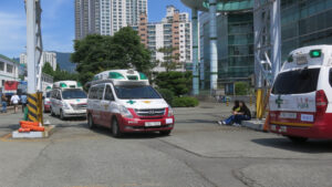 A row of South Korean emergency-medical ambulances parked during an emergency-response drill