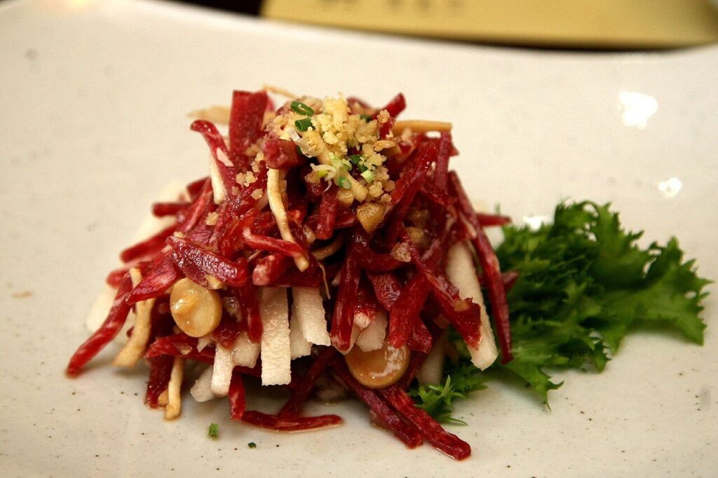 Yukhoe (육회) topped with a raw egg yolk and pine nuts. (Photo: Junho Jung, CC BY-SA 3.0 via Wikimedia Commons)